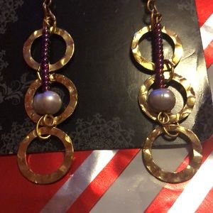 Dangly earrings with red beads and a pearl on each earring.